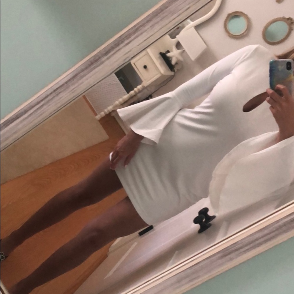 White form fit dress with bell sleeves